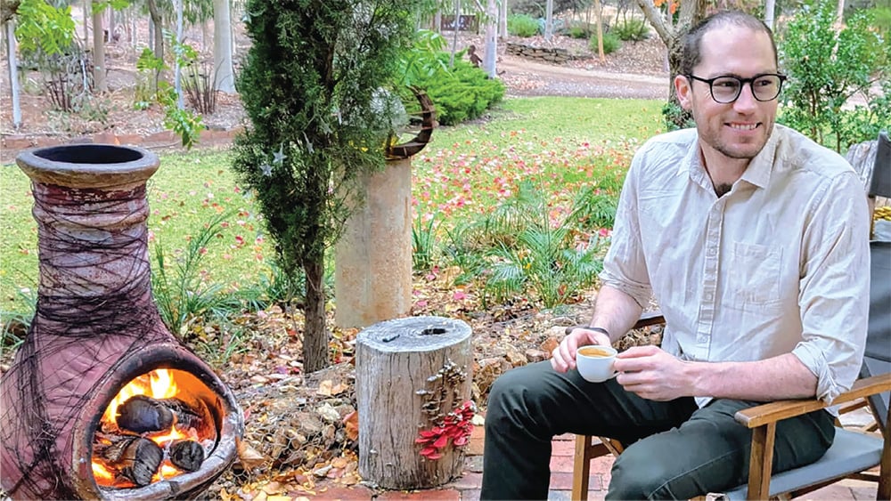 Dr Ned Chalmers relaxing in his garden