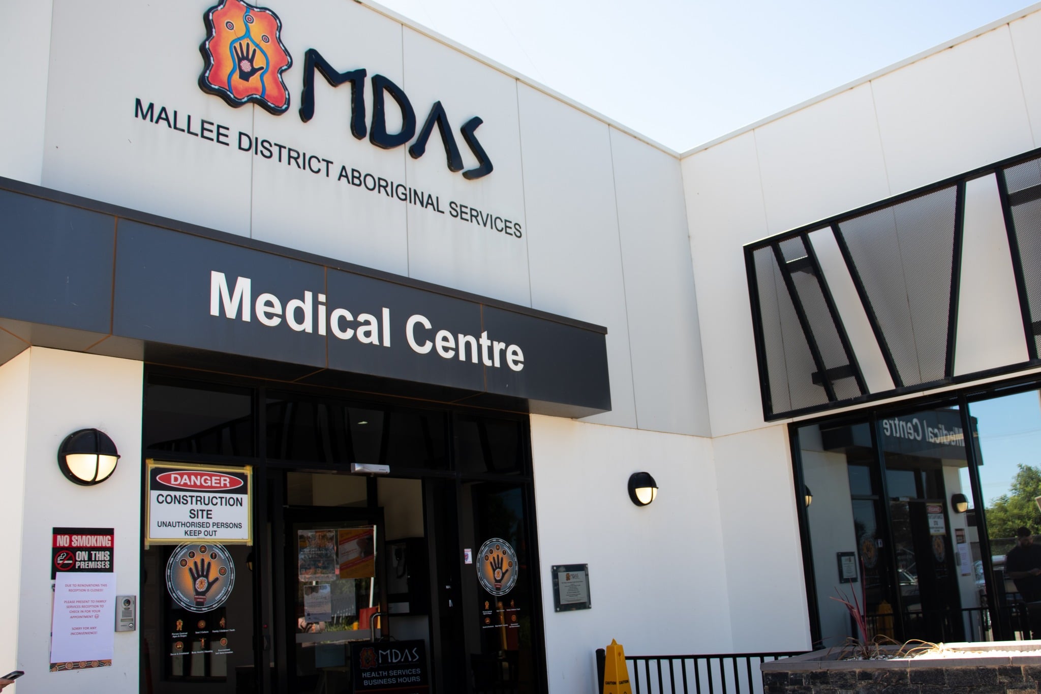 Entrance of MDAS Medical Centre with a sign above the door.
