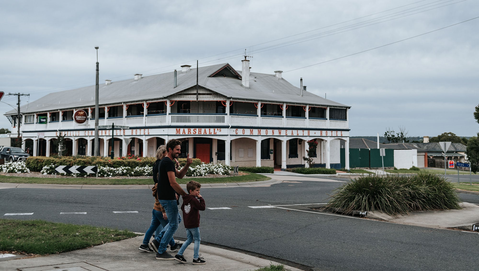 A family crosses a street near Marshall's Commonwealth Hotel in Orbost